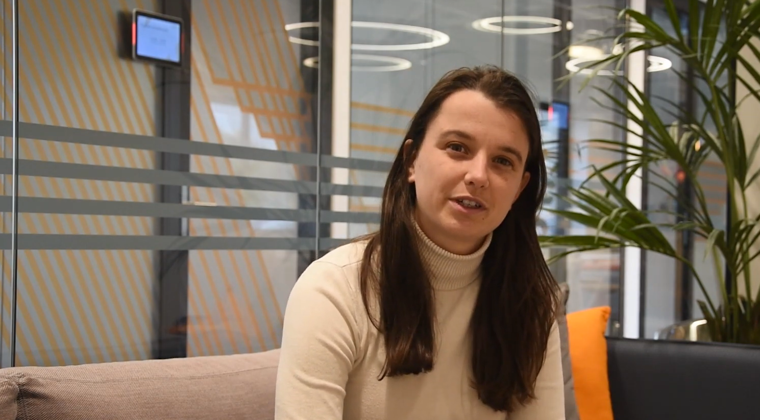 1. Professional woman at Keylane Careers office, diverse workplace, modern interior, collaborative environment, job opportunities, career growth, insurance technology, software solutions, professional development.