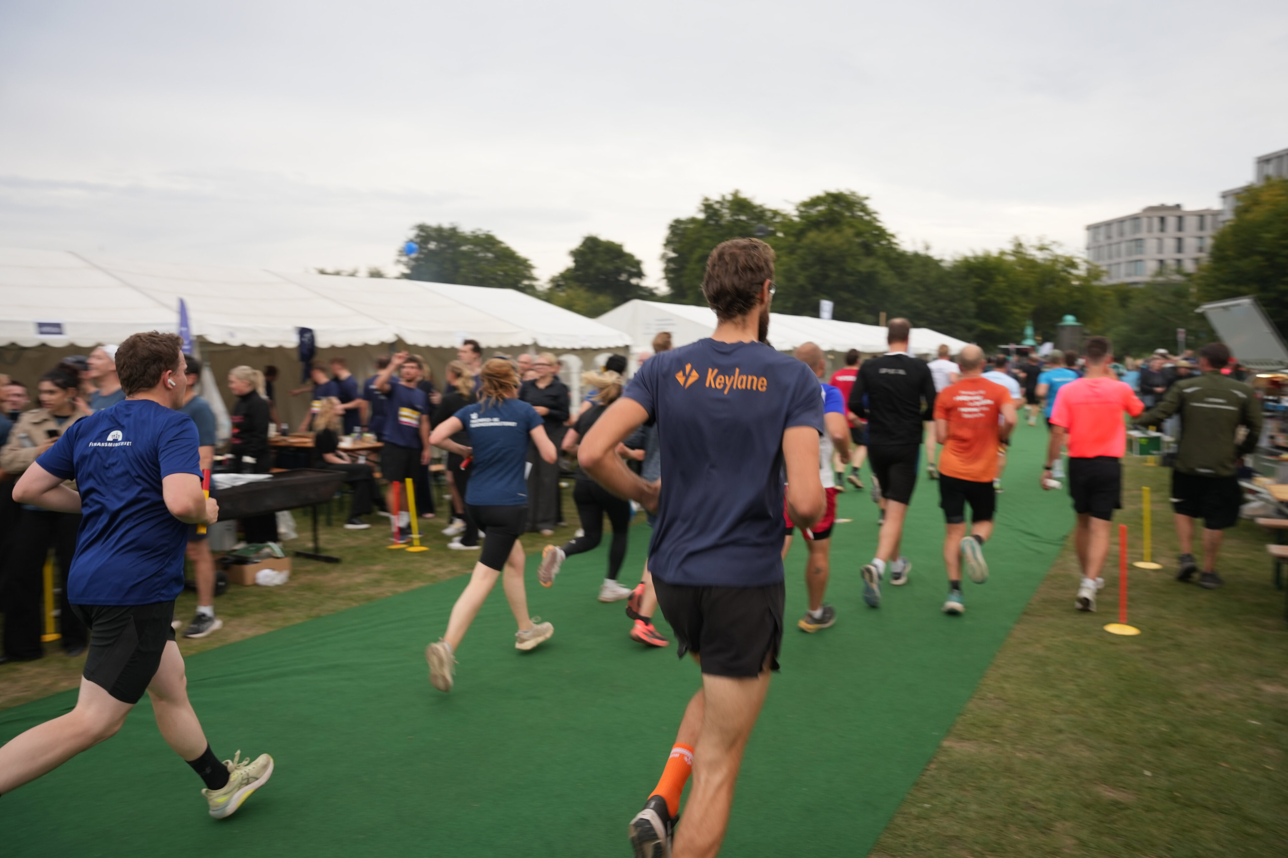 Active professionals participating in a corporate team-building event at Keylane Careers, showcasing company culture, teamwork, and engagement in a vibrant outdoor setting.