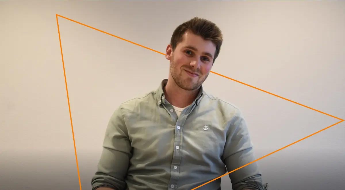 Innovative Keylane Careers opportunity featuring a professional young man smiling in an office environment. Emphasizes careers in software, technology, and insurance solutions at Keylane.