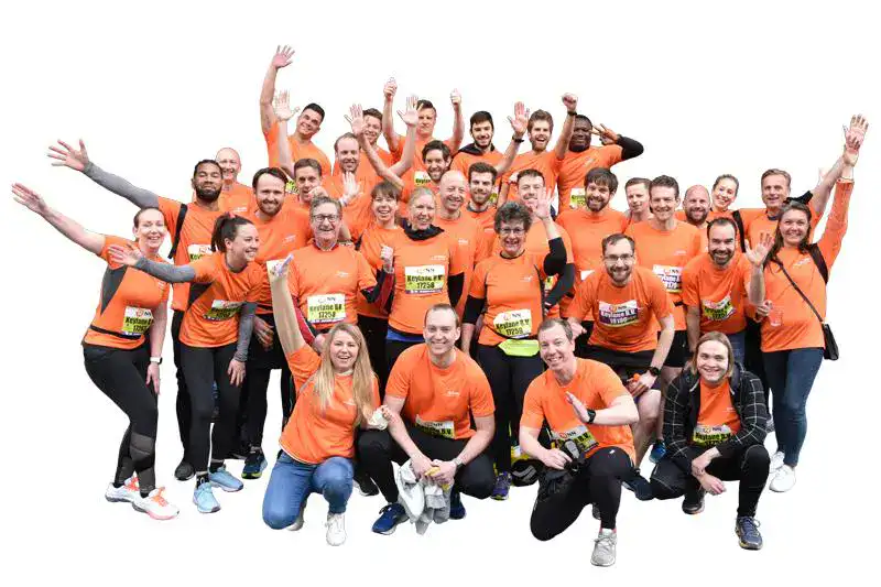 Vibrant team of diverse professionals participating in a charity run, representing Keylane Careers, showcasing company culture, teamwork, and commitment to community engagement in the tech and finance sector.