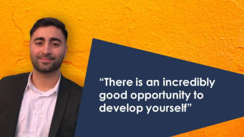 Motivated professional smiling in business attire at Keylane Careers, emphasizing growth opportunities in the tech and insurance industries.