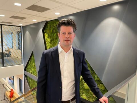 Innovative business professional at Keylane corporate office, highlighting careers in fintech and insurance technology.